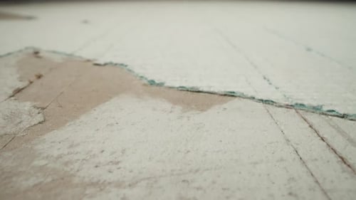 Plasterboard with Torn Coverage and Scratches From Cutter