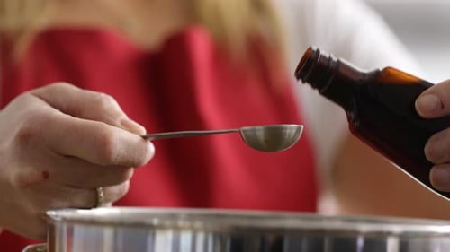 Liquid Pouring Into Spoon for Cooking