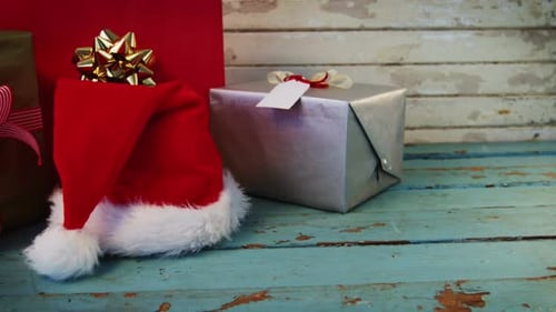 Christmas Presents and Santa Hat on Table