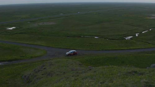Aerial View of Car with Open Doors Standing at Dirt Road Crossroad in Countryside