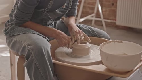 Woman Working with Pottery Wheel