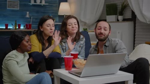 Multiethnic Friends Sitting on Couch Having Online Videocall Meeting