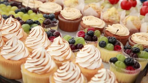 Cakes are Lying on the Counter in the Street Confectionery