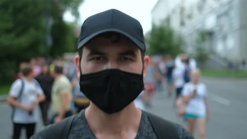Young Adult Wearing Mask in Crowd