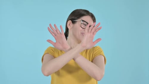 Woman Gesturing No with Crossed Arms