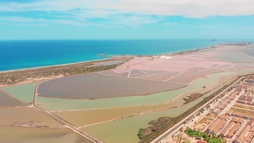 Multicolored Salt Lakes with Coastal Salt Marshes, Aerial View, Video Shooting with Drone
