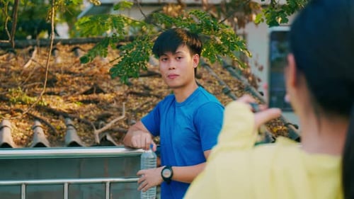 Man Posing as Woman Takes Photo