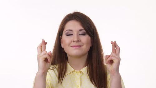 Woman Crossing Fingers Hoping For the Best