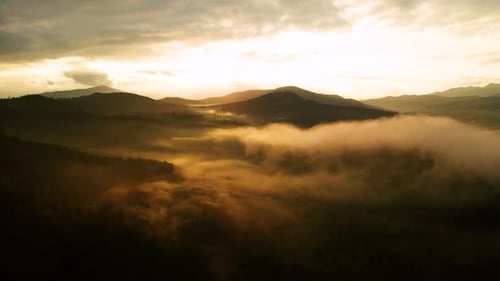 Aerial View of Mountains and Fog at Sunrise