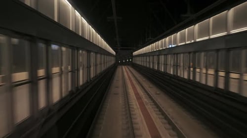 View of Subway Tunnel As Seen From the Rear Window of Moving Train. Fast Underground Train Departs