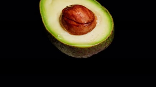 Avocado Half Isolated on Black Background Chroma Key Fresh Sliced Avocado Closeup