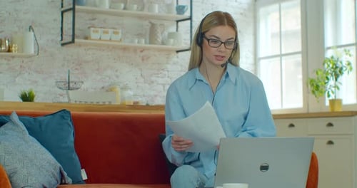 Woman on Video Call with Laptop at Home