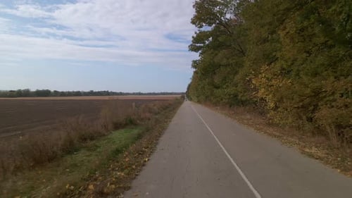 Aerial View of Car Driving Far on Countryside Road