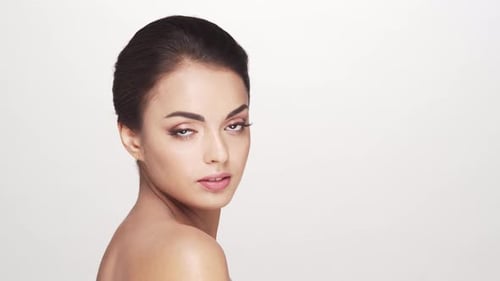 Studio portrait of young and beautiful brunette woman over