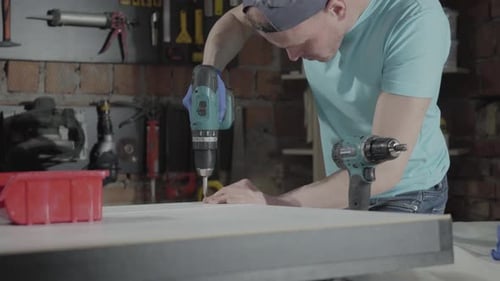 Portrait Skill Master Engineer Focused on Drilling a Hole with Tool