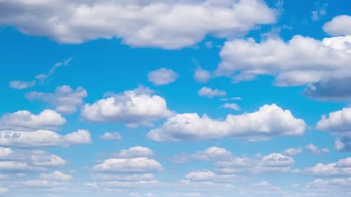 White Clouds Flying on Blue Sky. Timelapse