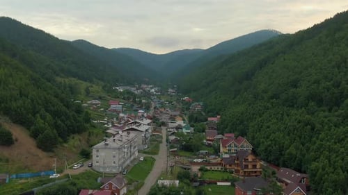 Flight Over the Village Between the Forest Hills