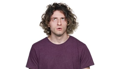 Man With Curly Hair Making Facial Expressions