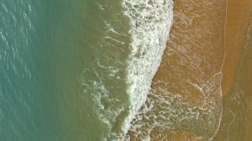 Flying Above Sand Sea Beach