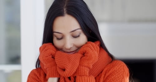 Smiling Woman Wearing Orange Winter Knitwear