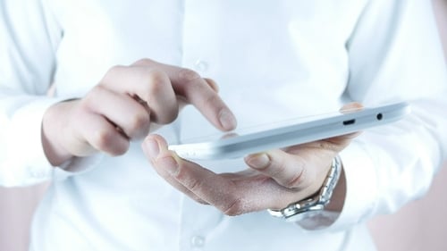 Businessman Using Touchpad In Office