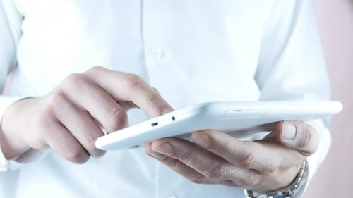 Businessman Typing Sms On Touchpad