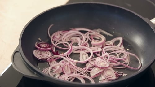 Red Onion Frying In a Pan