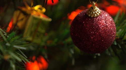 Glitter Christmas Ball Ornament on Christmas Tree