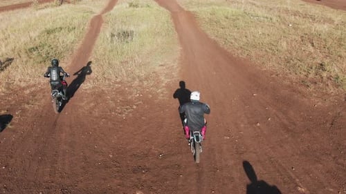 Drone Shot of Motocross Riders Racing on Off-Road Track