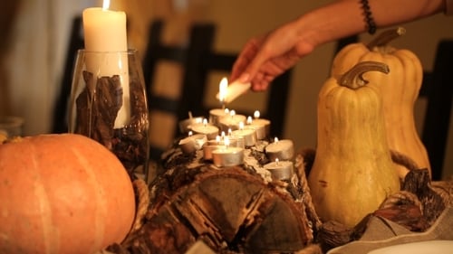 Lighting Tea Light Candles with Pumpkins for Fall Decor