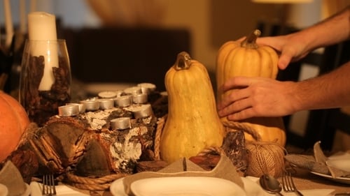 Elegant Table Setting with Pumpkins and Candles