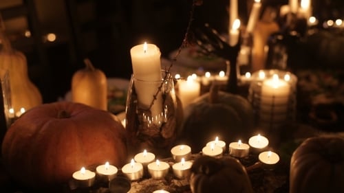 Halloween Holiday Table With Candles And Pumpkins