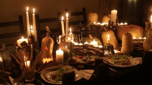 Halloween Table with Pumpkins and Candlelight