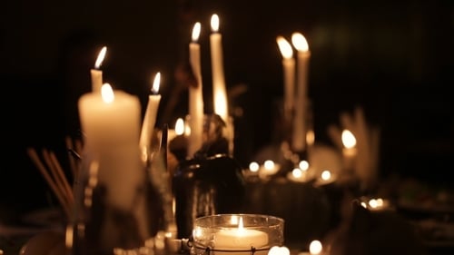 Candles and Pumpkins Glow in the Night