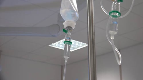 Intravenous Drip Bag with Clear Fluid in Hospital