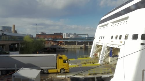 Truck Getting Into Cargo Section Of a Ship