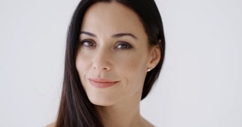 Attractive Woman Smiles Directly at Camera