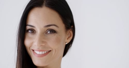 Smiling Woman Portrait Against a White Background