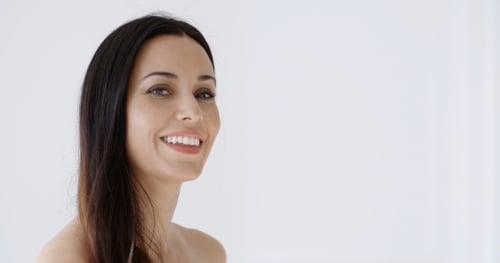 Elegant Woman Smiling in Studio Close-Up