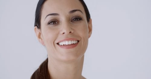 Woman Smiling and Looking at the Camera