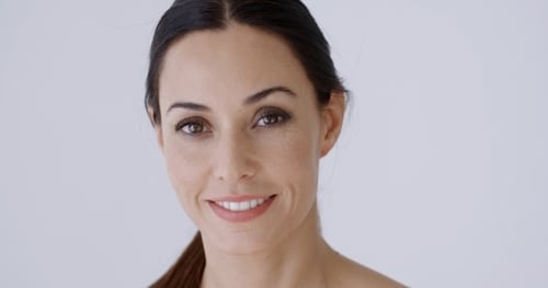 Attractive Woman Smiling in Close Up Portrait