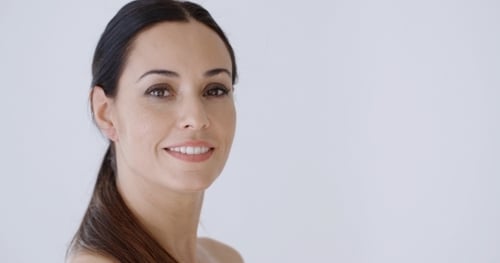 Woman Smiling Towards Camera in Close Up Shot