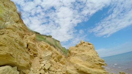 White Clouds over Rocky Beach