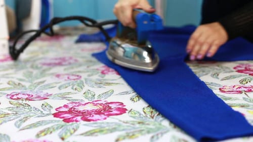 Woman Irons Clothes