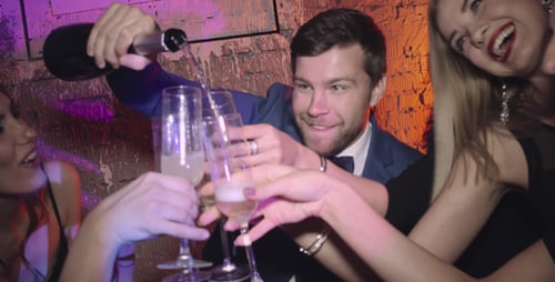 Friends Celebrate with Champagne at Nightclub