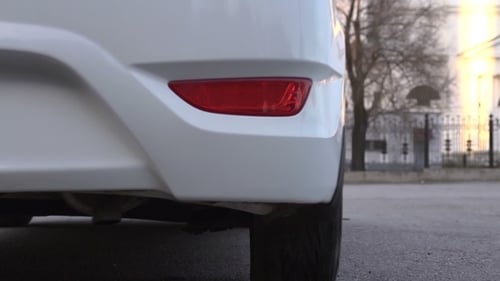 Car Pulls In At Parking Lot