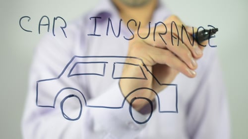 Person Draws Car And Writes Car Insurance