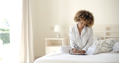 Girl Writes A Diary In Bed