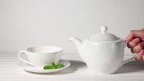 Tea Pouring from Teapot to Teacup