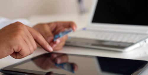Person Using Tablet Computer Holding Pen